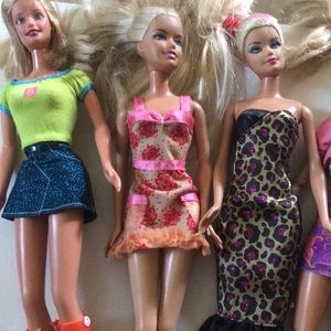 7 Barbie Dolls
